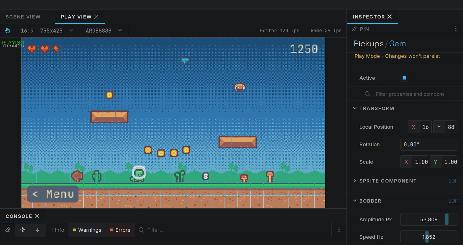 The editor during play: the gem&rsquo;s bob raised in the inspector, the gem high above the platforms